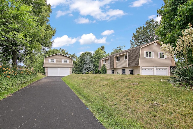15630 Le Claire Ave, Oak Forest, IL 60452 - view of front facade featuring a gambrel roof, an attached garage, a front lawn, and a shingled roof