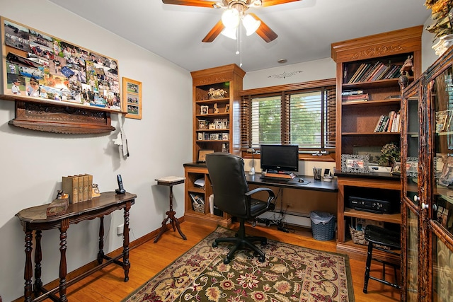 15630 Le Claire Ave, Oak Forest, IL 60452 - office area with a ceiling fan, wood finished floors, and a baseboard radiator