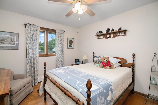 15630 Le Claire Ave, Oak Forest, IL 60452 - bedroom featuring wood finished floors, a baseboard radiator, and ceiling fan