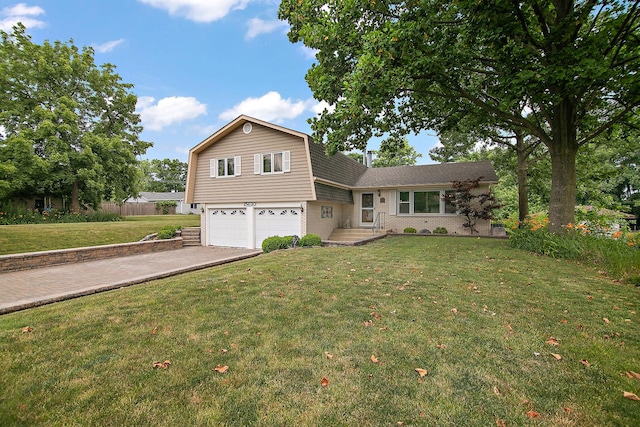 15630 Le Claire Ave, Oak Forest, IL 60452 - split level home featuring a garage, driveway, a front yard, and a gambrel roof