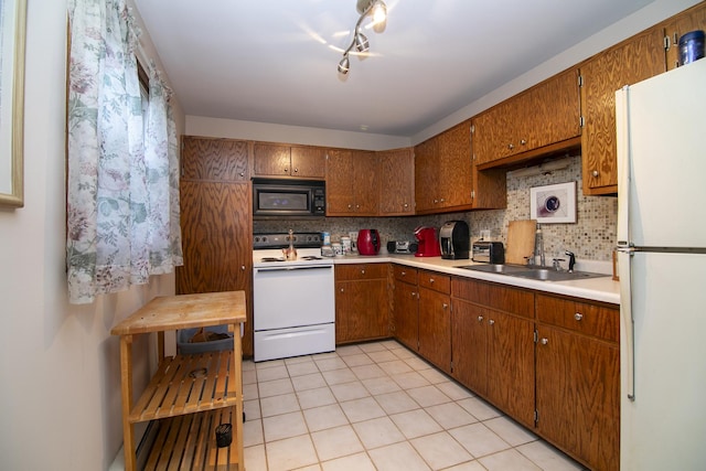 15630 Le Claire Ave, Oak Forest, IL 60452 - kitchen with white appliances, tasteful backsplash, and brown cabinets
