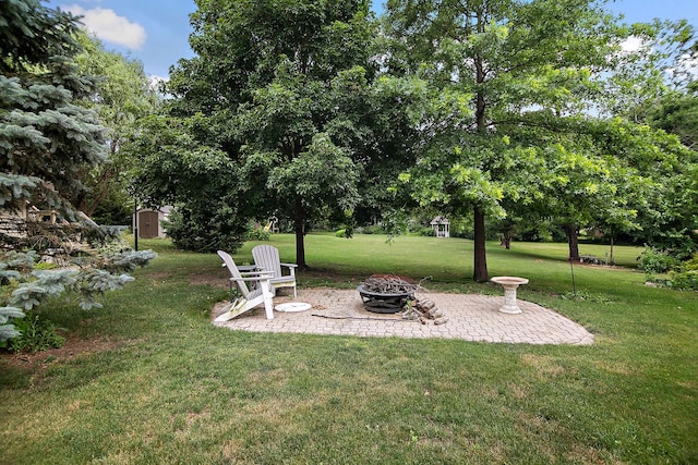 15630 Le Claire Ave, Oak Forest, IL 60452 - view of grassy yard featuring a fire pit and a patio
