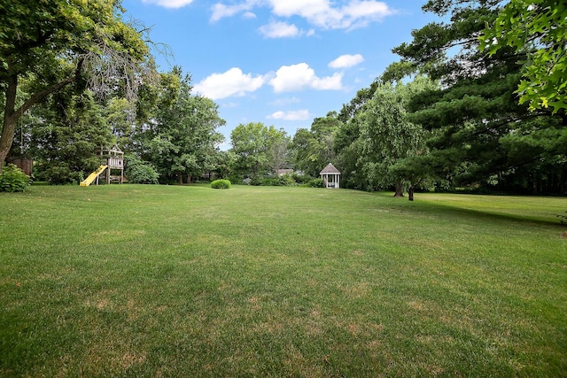 15630 Le Claire Ave, Oak Forest, IL 60452 - view of grassy yard featuring a playground, a gazebo, and view of scattered trees