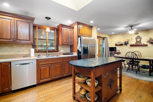 15630 Le Claire Ave, Oak Forest, IL 60452 - kitchen featuring appliances with stainless steel finishes, light wood-style flooring, recessed lighting, tasteful backsplash, and a ceiling fan