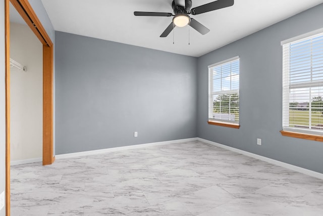 2225 National Sewing Ave, Belvidere, IL 61008 - unfurnished bedroom with marble look tile flooring, a closet, and ceiling fan