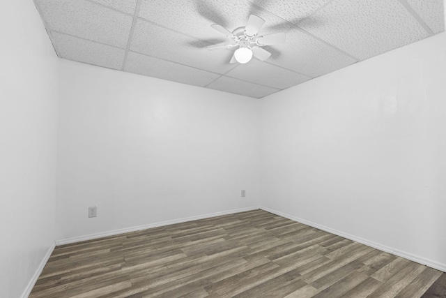 2225 National Sewing Ave, Belvidere, IL 61008 - unfurnished room featuring a drop ceiling, wood finished floors, and a ceiling fan