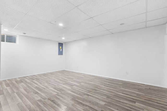 2225 National Sewing Ave, Belvidere, IL 61008 - below grade area with wood finished floors, electric panel, a drop ceiling, and recessed lighting