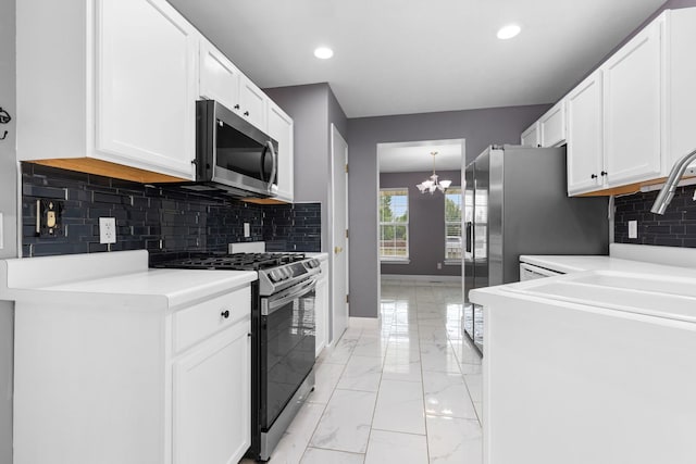 2225 National Sewing Ave, Belvidere, IL 61008 - kitchen featuring stainless steel appliances, a chandelier, white cabinetry, backsplash, and recessed lighting