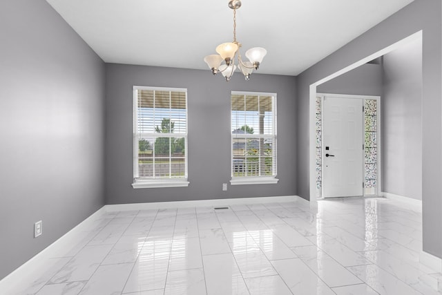 2225 National Sewing Ave, Belvidere, IL 61008 - unfurnished room with a chandelier and marble look tile flooring