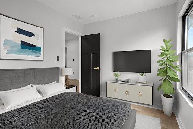 2305 W 111th Pl, Chicago, IL 60643 - bedroom featuring light wood-style flooring and baseboards