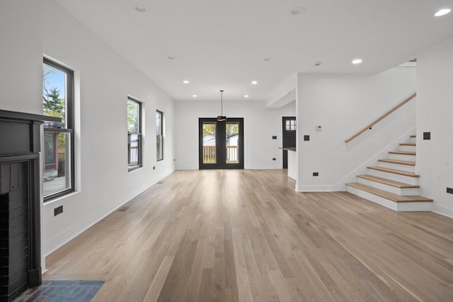 2305 W 111th Pl, Chicago, IL 60643 - unfurnished living room featuring healthy amount of natural light, light wood-type flooring, stairs, recessed lighting, and a fireplace