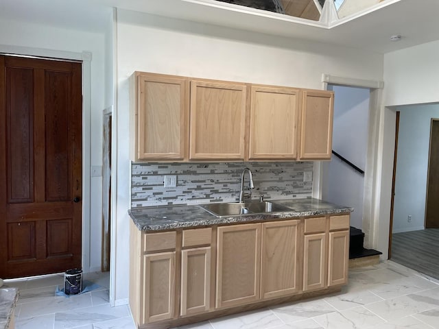 355 N 5th St, Sheldon, IL 60966 - kitchen featuring light brown cabinetry, dark countertops, and backsplash
