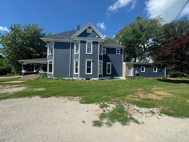 355 N 5th St, Sheldon, IL 60966 - view of front of house with a chimney, a front lawn, and driveway