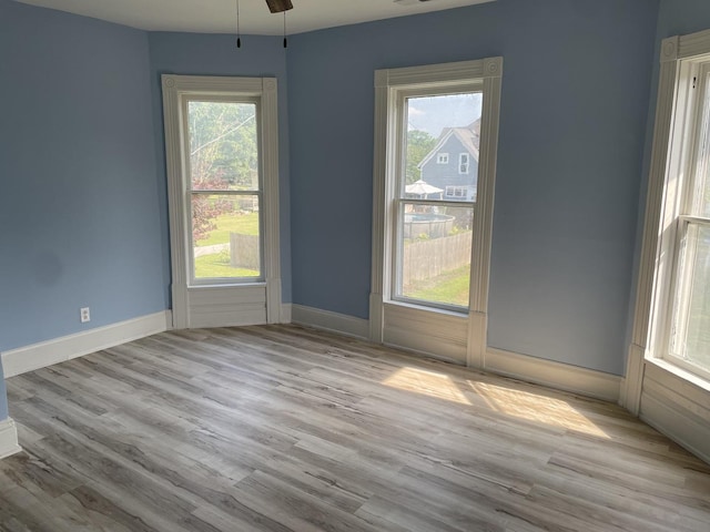 355 N 5th St, Sheldon, IL 60966 - unfurnished room with wood finished floors, healthy amount of natural light, and a ceiling fan