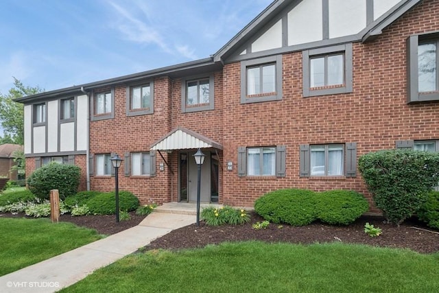 48 Parliament Dr W Unit 132, Palos Heights, IL 60463 - view of front of home with brick siding and a front lawn
