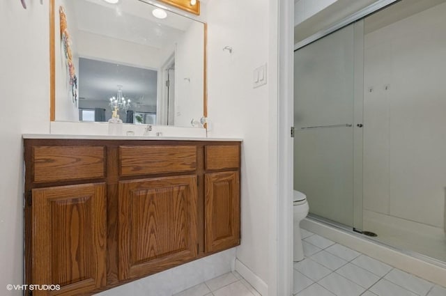 48 Parliament Dr W Unit 132, Palos Heights, IL 60463 - bathroom featuring tile patterned floors, vanity, a shower stall, and a chandelier