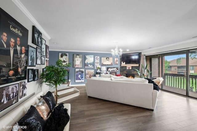 48 Parliament Dr W Unit 132, Palos Heights, IL 60463 - living room featuring crown molding, a chandelier, wood finished floors, and a warm lit fireplace