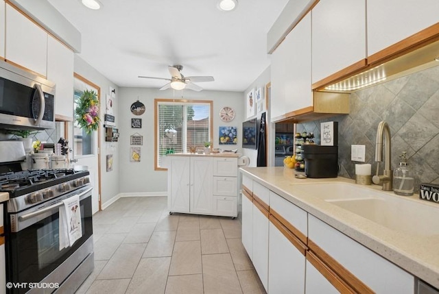 48 Parliament Dr W Unit 132, Palos Heights, IL 60463 - kitchen featuring appliances with stainless steel finishes, tasteful backsplash, light countertops, a ceiling fan, and recessed lighting