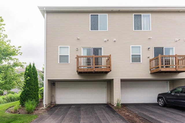 2366 Aurora Dr, Pingree Grove, IL 60140 - rear view of house with an attached garage, driveway, and a balcony