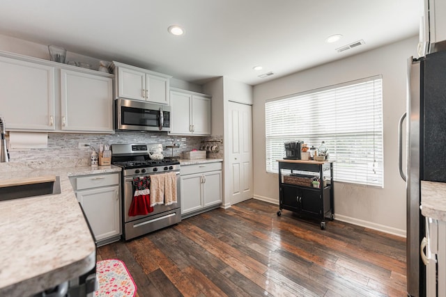 2366 Aurora Dr, Pingree Grove, IL 60140 - kitchen with stainless steel appliances, dark wood-style flooring, tasteful backsplash, and recessed lighting
