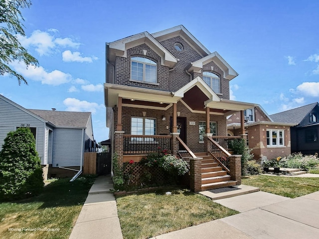 3129 N Oconto Ave, Chicago, IL 60707 - view of front of property featuring brick siding, covered porch, and a front yard