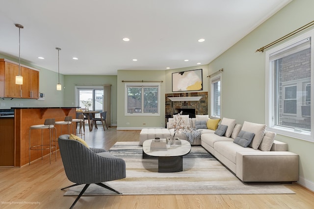 3129 N Oconto Ave, Chicago, IL 60707 - living room featuring light wood-type flooring, recessed lighting, and a fireplace