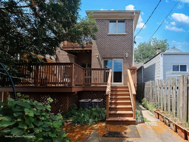 3129 N Oconto Ave, Chicago, IL 60707 - rear view of property featuring brick siding, a balcony, stairway, and a deck