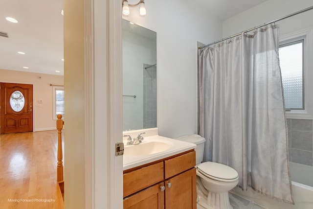 3129 N Oconto Ave, Chicago, IL 60707 - full bathroom with vanity, shower / tub combo with curtain, recessed lighting, and wood finished floors