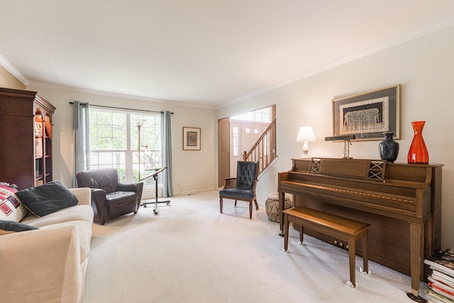 102 Quinlan Ave, Dekalb, IL 60115 - living room with crown molding, plenty of natural light, carpet floors, and stairway