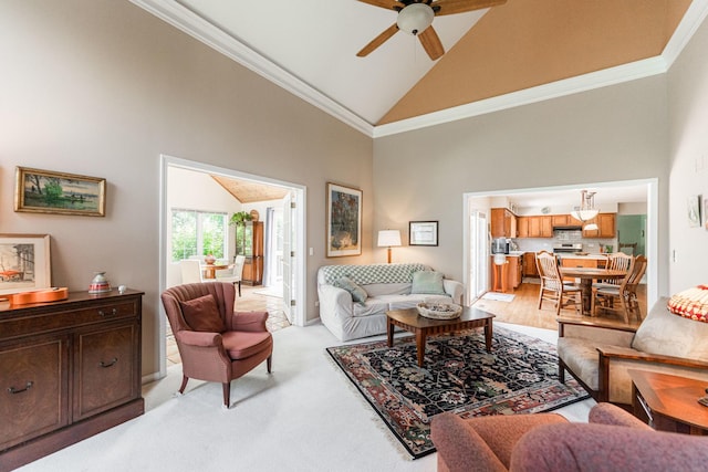 102 Quinlan Ave, Dekalb, IL 60115 - living area with high vaulted ceiling, a ceiling fan, ornamental molding, and light carpet