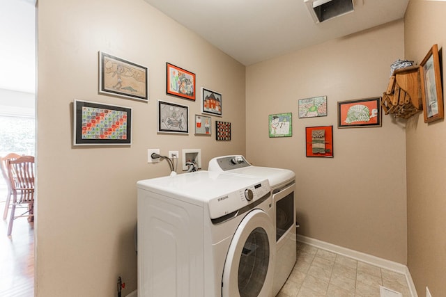 102 Quinlan Ave, Dekalb, IL 60115 - laundry area with independent washer and dryer and baseboards