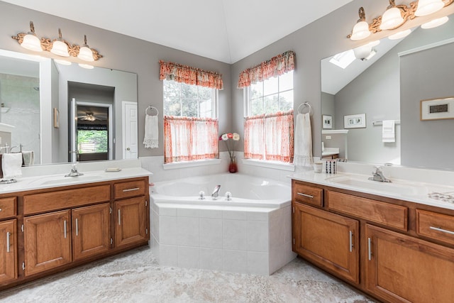 102 Quinlan Ave, Dekalb, IL 60115 - full bath with lofted ceiling, two vanities, a garden tub, a skylight, and tile patterned floors