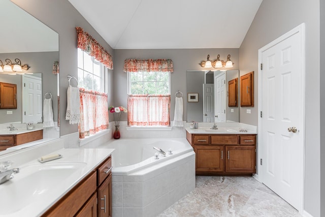 102 Quinlan Ave, Dekalb, IL 60115 - full bathroom featuring lofted ceiling, two vanities, and a bath