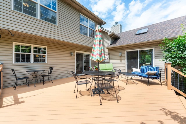 102 Quinlan Ave, Dekalb, IL 60115 - wooden deck with outdoor dining area and outdoor lounge area