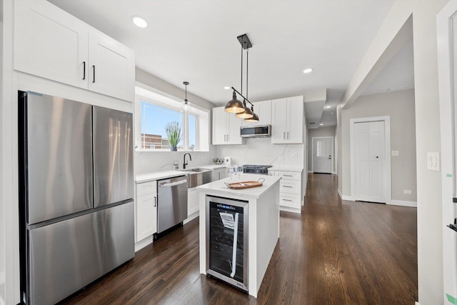 2101 S 48th Ct, Cicero, IL 60804 - kitchen with appliances with stainless steel finishes, wine cooler, decorative backsplash, light countertops, and recessed lighting