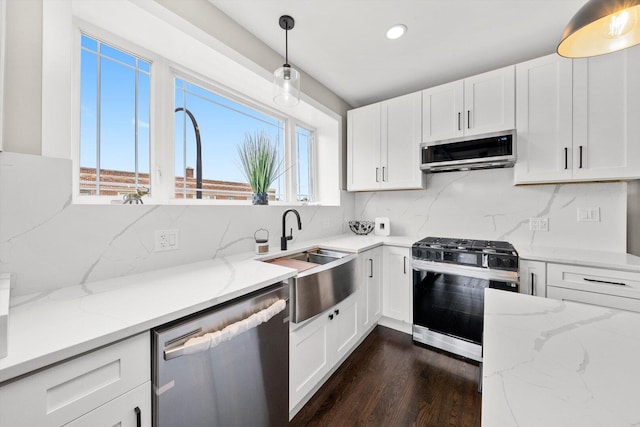 2101 S 48th Ct, Cicero, IL 60804 - kitchen featuring stainless steel appliances, white cabinetry, tasteful backsplash, light stone countertops, and recessed lighting