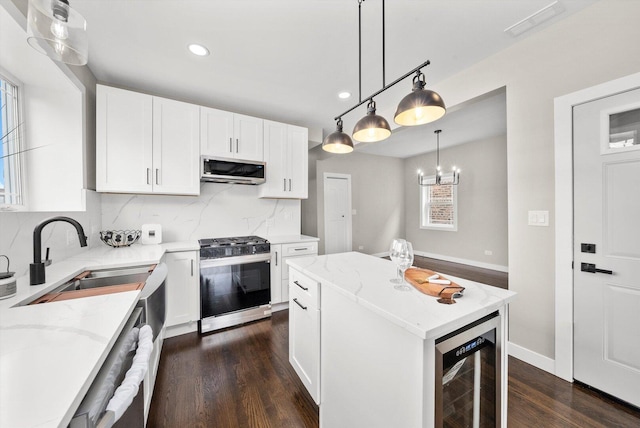 2101 S 48th Ct, Cicero, IL 60804 - kitchen with stainless steel appliances, wine cooler, light stone countertops, tasteful backsplash, and dark wood-style flooring