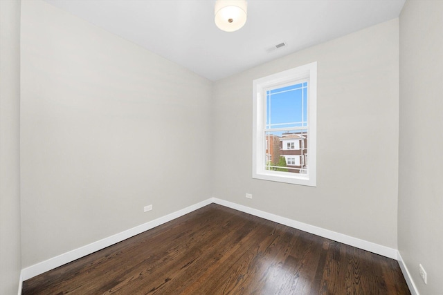 2101 S 48th Ct, Cicero, IL 60804 - empty room featuring baseboards and dark wood-type flooring