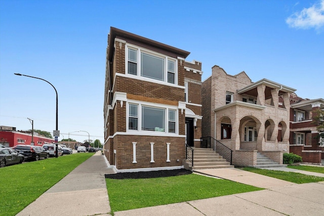 2101 S 48th Ct, Cicero, IL 60804 - view of property with brick siding and a front yard