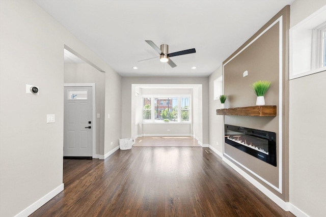 2101 S 48th Ct, Cicero, IL 60804 - unfurnished living room with dark wood-style flooring, ceiling fan, a glass covered fireplace, and recessed lighting