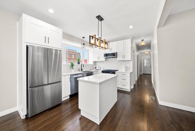 2101 S 48th Ct, Cicero, IL 60804 - kitchen with stainless steel appliances, dark wood-type flooring, light countertops, white cabinetry, and recessed lighting
