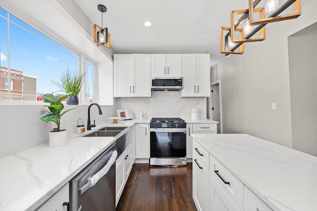 2101 S 48th Ct, Cicero, IL 60804 - kitchen featuring stainless steel appliances, dark wood-style floors, recessed lighting, light stone counters, and white cabinets
