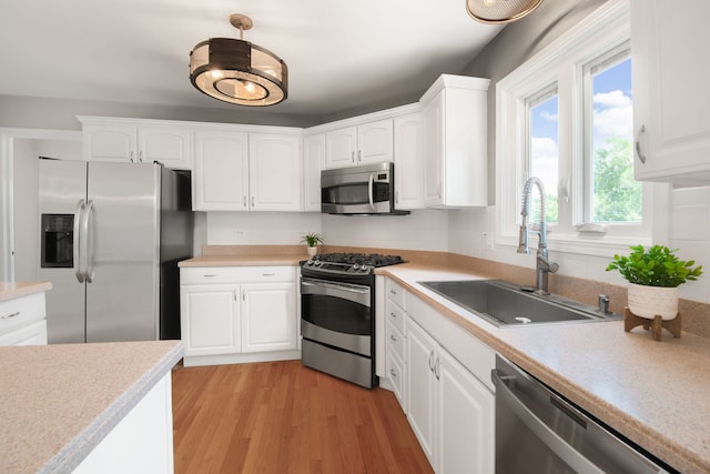 401 Kerry Ct, Prospect Heights, IL 60070 - kitchen with appliances with stainless steel finishes, white cabinetry, and light countertops