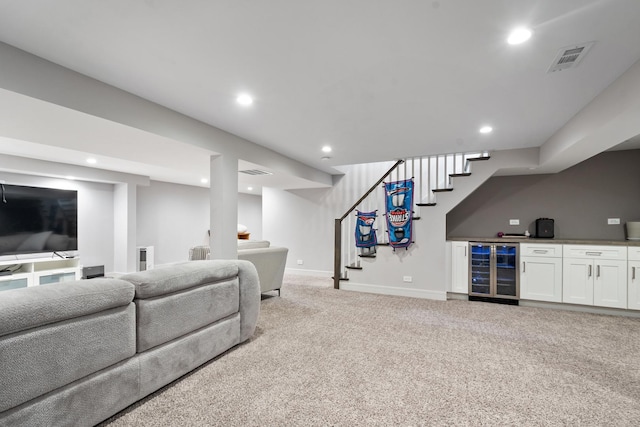 1017 Dell Rd, Northbrook, IL 60062 - living room with beverage cooler, stairs, bar area, light colored carpet, and recessed lighting