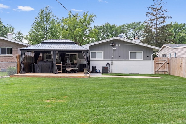 1017 Dell Rd, Northbrook, IL 60062 - rear view of property with a gazebo, a wooden deck, a chimney, a gate, and brick siding