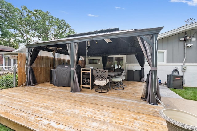1017 Dell Rd, Northbrook, IL 60062 - wooden deck with outdoor dining space and grilling area