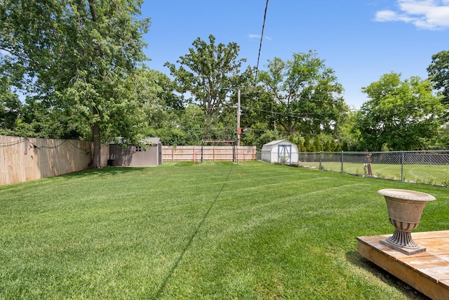 1017 Dell Rd, Northbrook, IL 60062 - fenced backyard featuring a shed and view of wooded area