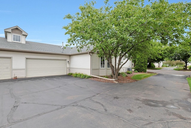 12243 Quail Ridge Dr, Huntley, IL 60142 - view of front facade with asphalt driveway, a shingled roof, and an attached garage