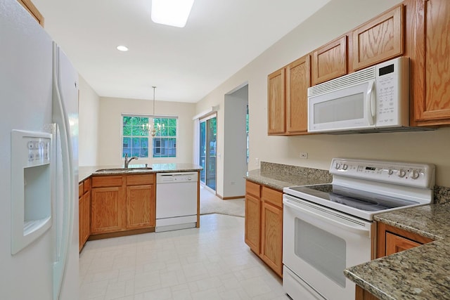 12243 Quail Ridge Dr, Huntley, IL 60142 - kitchen featuring white appliances, brown cabinets, light flooring, pendant lighting, and recessed lighting