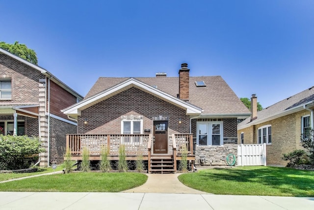 5921 N Navarre Ave, Chicago, IL 60631 - bungalow with brick siding, a chimney, a front yard, and roof with shingles